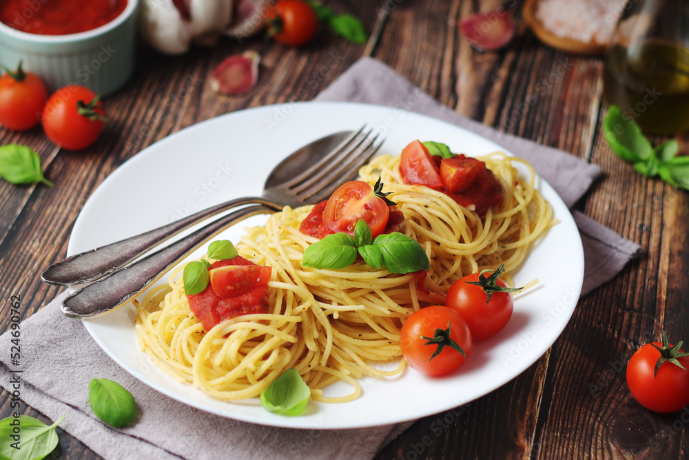 Italian pasta spaghetti with basil and cherry tomatoes Italian pasta spaghetti with basil and cherry tomatoes