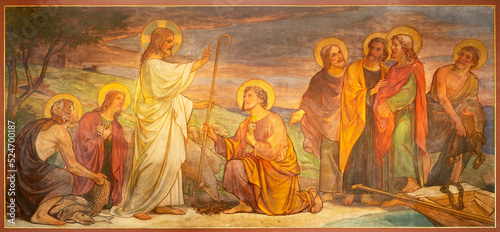 BERN, SWITZERLAND - JUNY 27, 2022: The fresco Jesus consigning the keys to Peter in the church Dreifaltigkeitskirche by August Müller (1923). photo