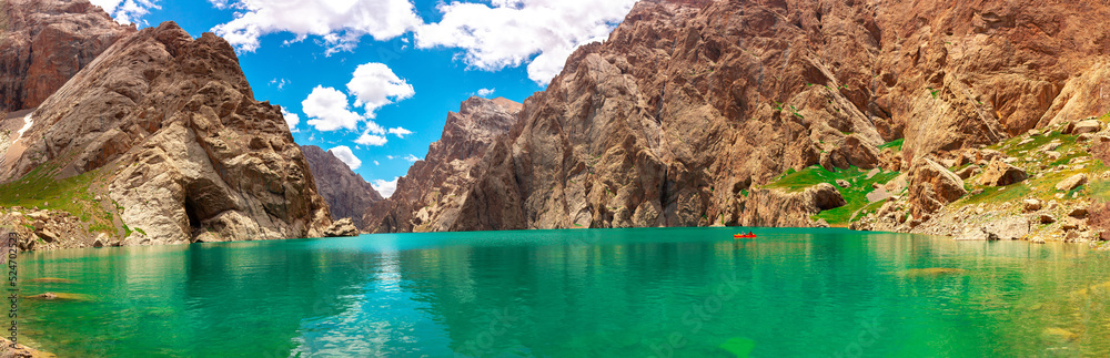 Mountain blue lake among the rocks. Beautiful landscape. Wonderful nature. Long banner, panoramic view Mountain blue lake among the rocks. Beautiful landscape. Wonderful nature. Long banner, panoramic view