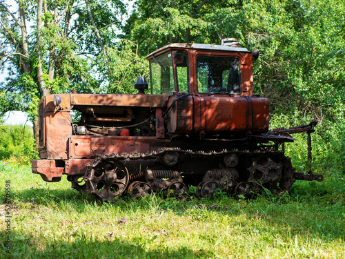 Old red caterpillar tracked tractor