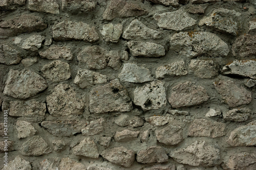 abstract grunge background: rough wall of granite stones and concrete abstract grunge background: rough wall of granite stones and concrete