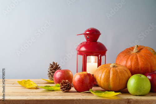 Fototapeta Naklejka Na Ścianę i Meble -  Autumn still life with  pumpkin and apples  on wooden table. Thanksgiving holiday background