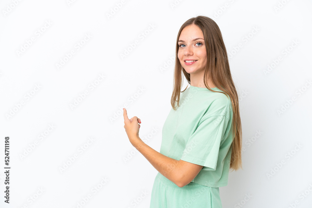 Young Lithuanian woman isolated on white background pointing back Young Lithuanian woman isolated on white background pointing back