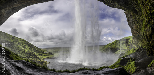 Panoramic from behind Iceland waterfall 