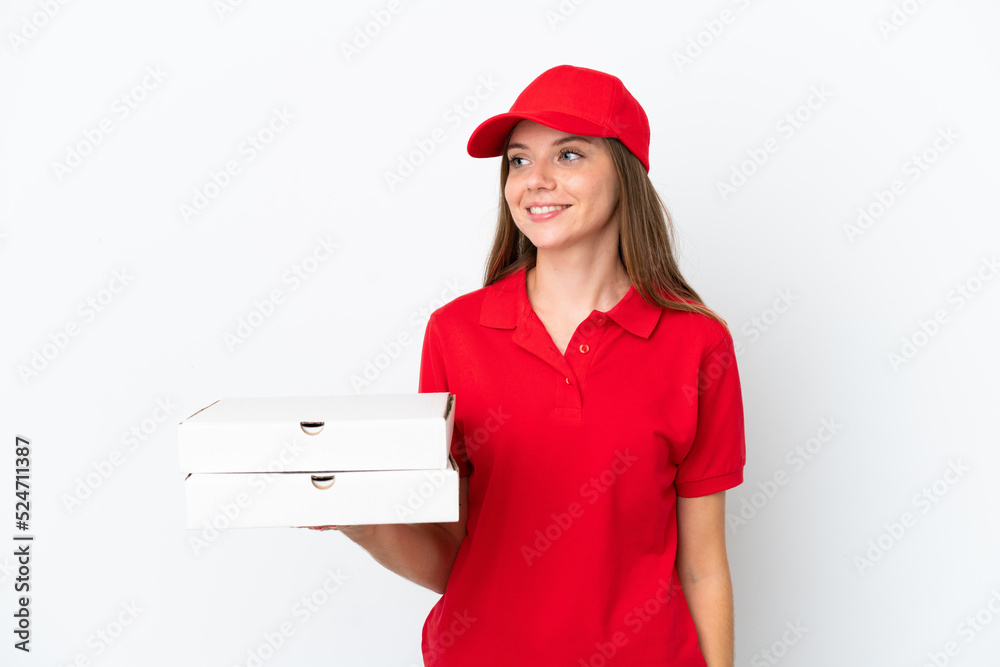 Pizza delivery Lithuanian woman isolated on white background looking to the side and smiling Pizza delivery Lithuanian woman isolated on white background looking to the side and smiling