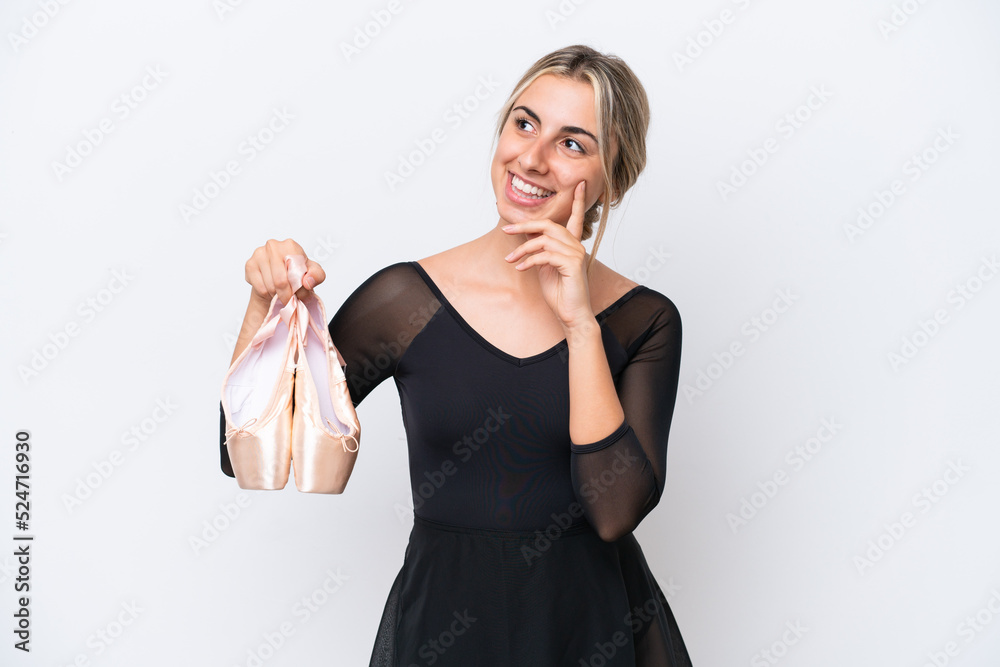 Young caucasian woman practicing ballet isolated on white background thinking an idea while looking up Young caucasian woman practicing ballet isolated on white background thinking an idea while looking up