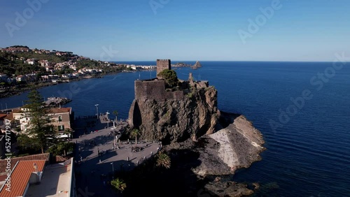 Norman castle of Aci Castello, the castle is situated on a rocky outcrop jutting out into the sea. Its precise date of construction is uncertain, but it was important to the development of its region  photo