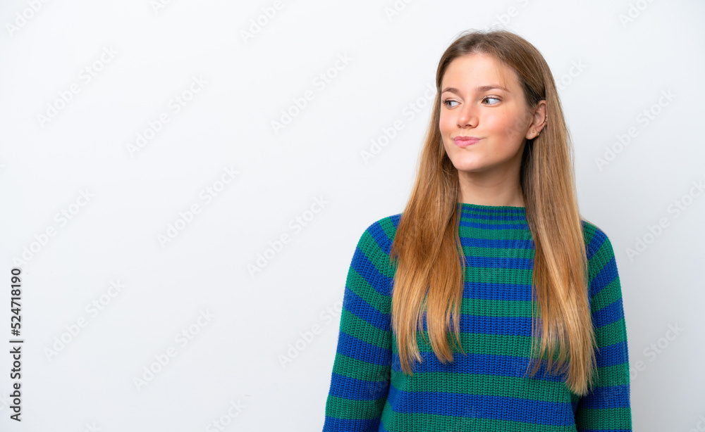 Young caucasian woman isolated on white background having doubts while looking side Young caucasian woman isolated on white background having doubts while looking side
