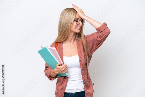 Pretty student blonde woman isolated on white background has realized something and intending the solution