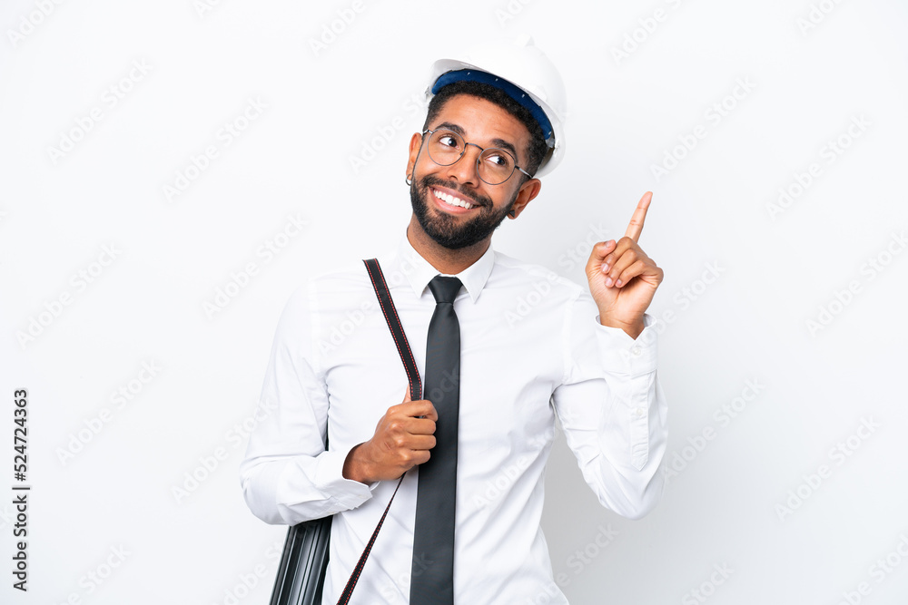 Young architect Brazilian man with helmet and holding blueprints isolated on white background pointing up a great idea Young architect Brazilian man with helmet and holding blueprints isolated on white background pointing up a great idea