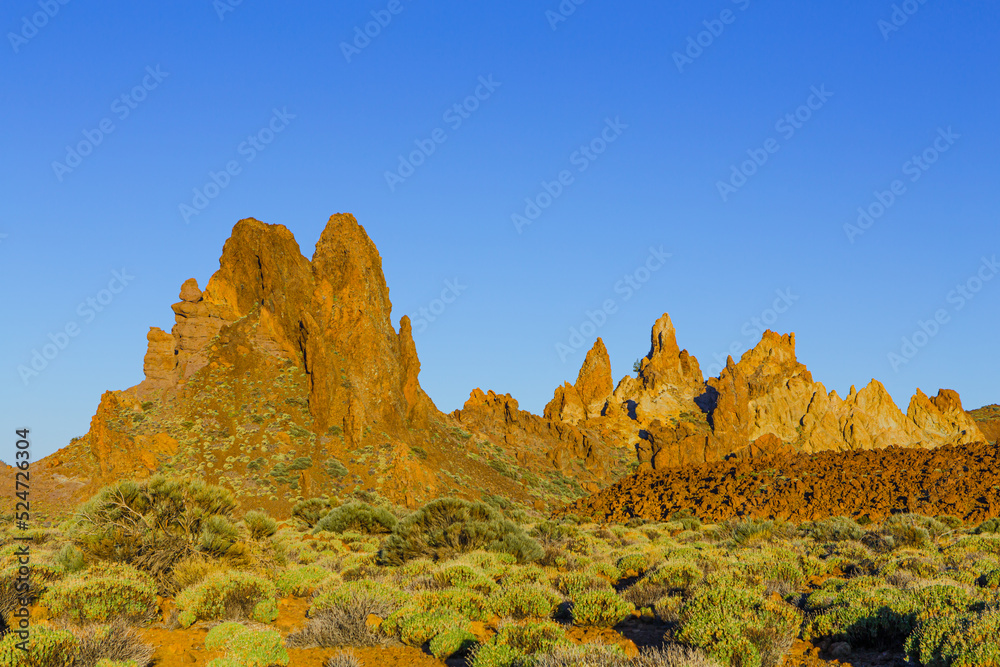 The volcanic rock formations of 'Los Roques de Garcia' in the caldera of the El Teide strato volcano in early morning light, UNESCO World Heritage Site, Tenerife, Spain