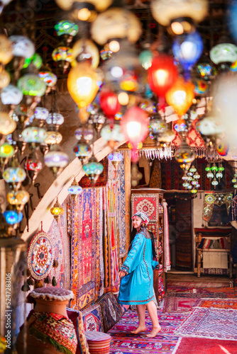 Beautiful woman surrounded by colorful lanterns © BlueOrange Studio