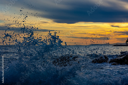 Mediterranean sea coast at sunset with waves