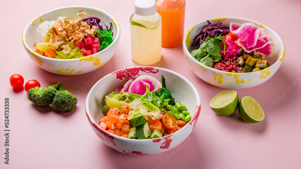 Poke with salmon, poke with tuna, poke with beef on pink background with lemonades Poke with salmon, poke with tuna, poke with beef on pink background with lemonades