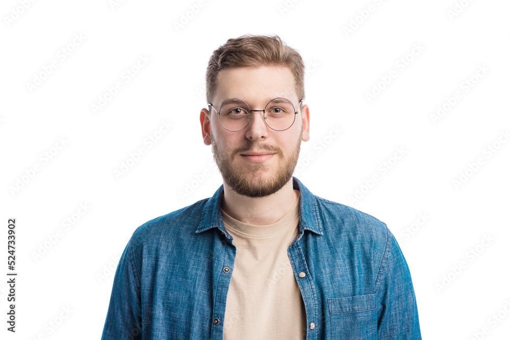 Handsome caucasian man with calm face posing over white studio background. Confident unshaven guy wearing round eyeglasses and casual denim shirt. Handsome caucasian man with calm face posing over white studio background. Confident unshaven guy wearing round eyeglasses and casual denim shirt.