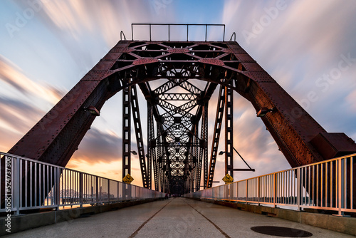 The Big Four Bridge that connected Kentucky and Indiana is an old railroad truss bridge, originally built in 1895, and was converted into a path for people to cross the Ohio River. Long exposure.