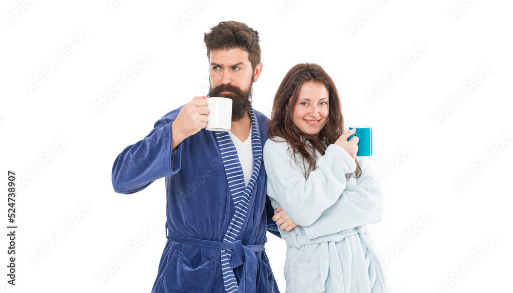 With coffee morning tastes better. Couple relax in morning with coffee. Couple enjoy lazy weekend and drink coffee. Man and woman wear bathrobes hold tea mug or coffee cup. Caffeine power concept With coffee morning tastes better. Couple relax in morning with coffee. Couple enjoy lazy weekend and drink coffee. Man and woman wear bathrobes hold tea mug or coffee cup. Caffeine power concept