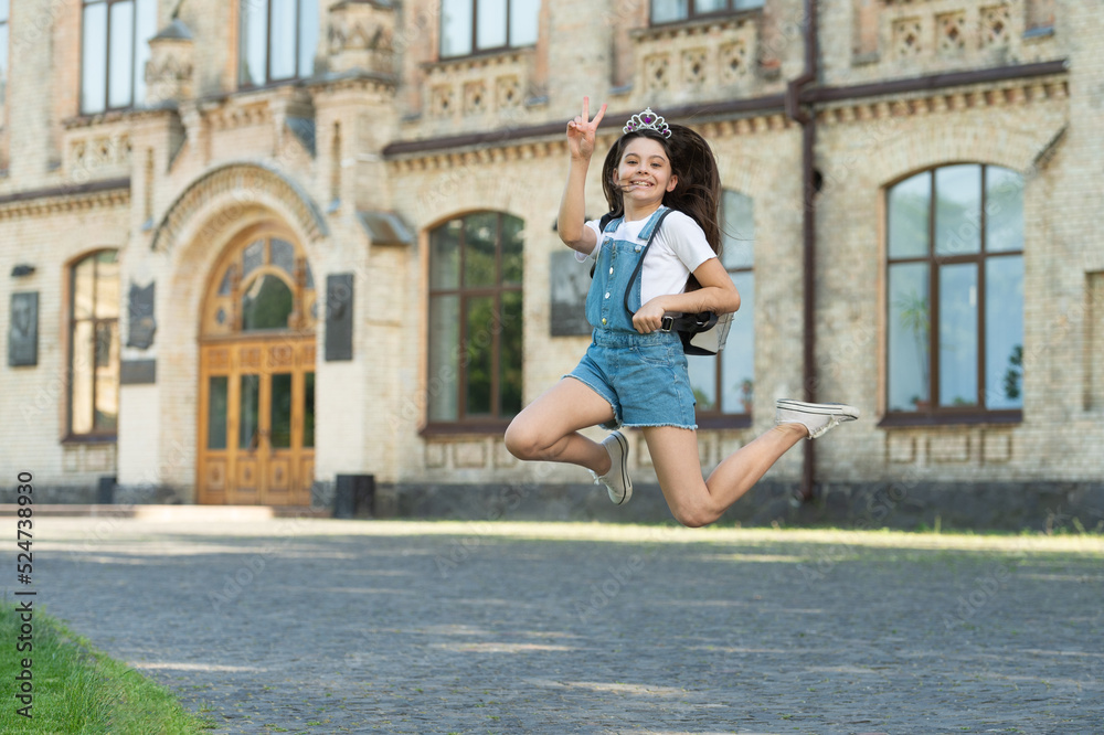 positive teen kid jump. energetic teen girl jump outdoor. free teen child jump