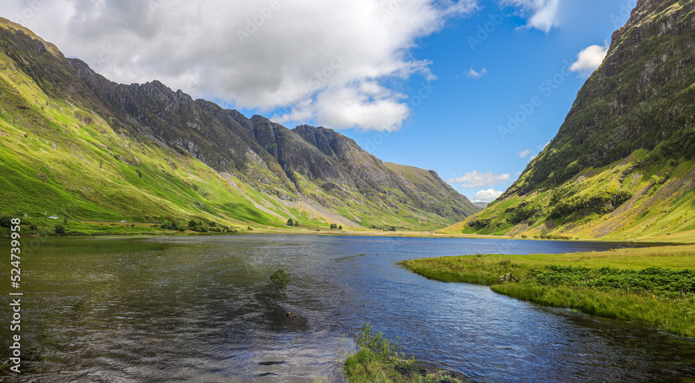 The scenic view of Loch Achtriochtan in Glencoe, ScotlandLoch Achtriochtan or Loch Trychardan is a small shallow freshwater loch located to the east of Glencoe village in Scottish Highlands.