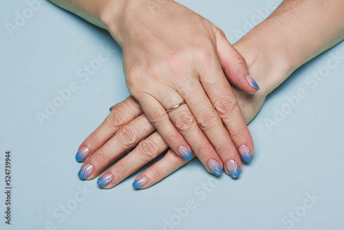 Blue winter nail art design on light background