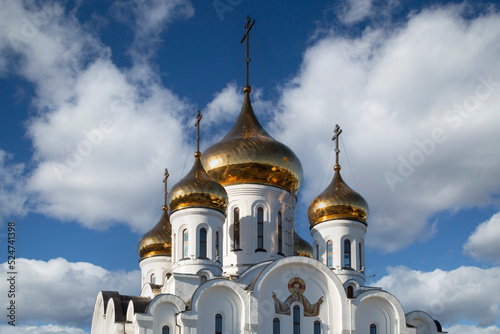 Orthodox Church in Syktyvkar on a sunny day with clouds. photo