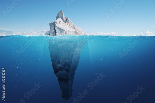Amazing iceberg with a hidden iceberg underwater in the ocean. The tip of the iceberg, a concept. Creative idea of a hidden danger. Global warming and melting glaciers