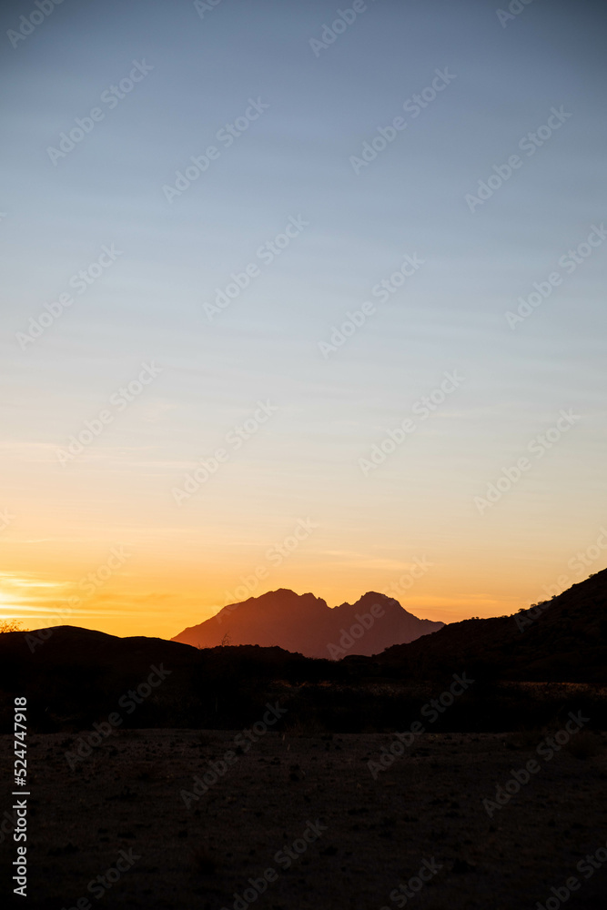 bright sunset over red desert of Namibia
