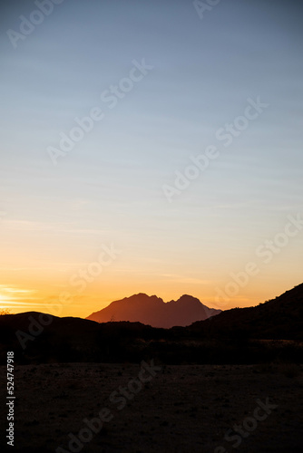 bright sunset over red desert of Namibia © Zach