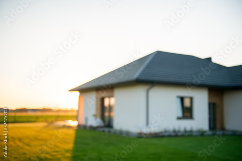 Wallpaper Mural Blurred view of beautiful house with green lawn on sunny day Torontodigital.ca