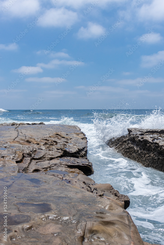 Waves crashing on rocks