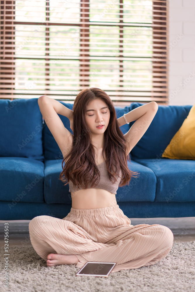 woman stretching her body because feel tired after waching tablet, Lifestyle woman relax at home concept woman stretching her body because feel tired after waching tablet, Lifestyle woman relax at home concept