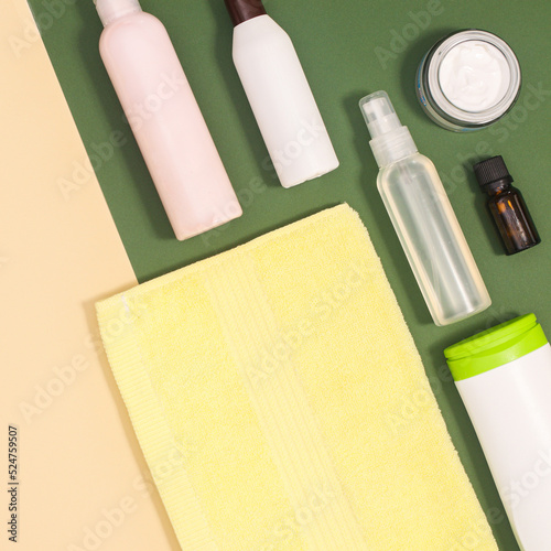 Creative beauty cosmetics  and spa produts on beige and green background with copy space. Flat lay