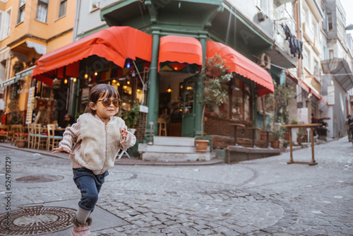 playful little girl enjoying her holiday exploring the city in istanbul turkiye © Odua Images