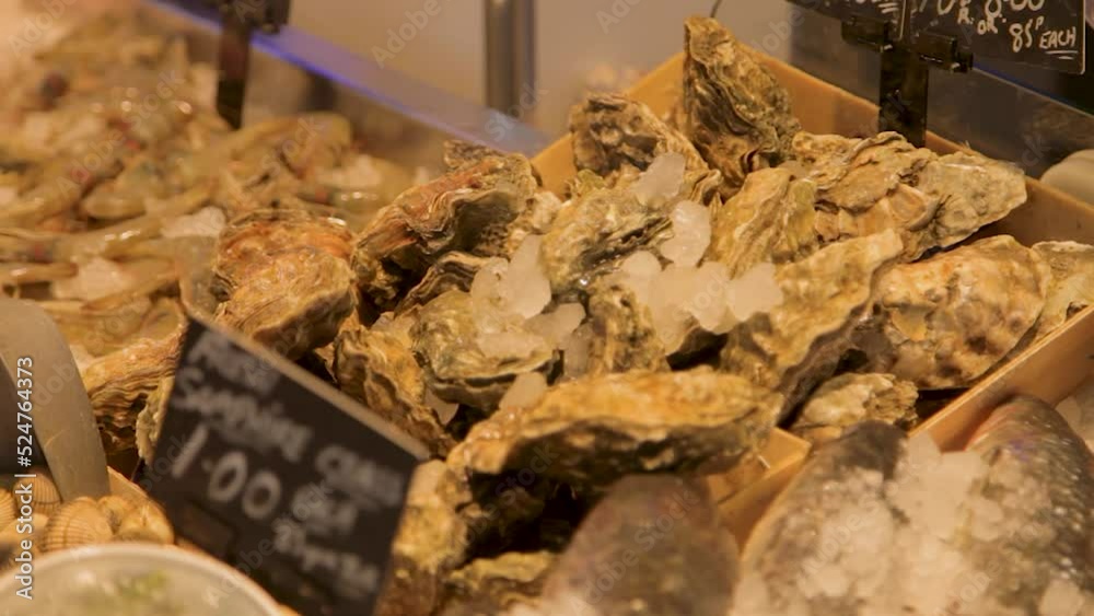 Fresh Oysters Covered in Ice Ready for Sale Swansea Indoor Market Wales UK Fresh Oysters Covered in Ice Ready for Sale Swansea Indoor Market Wales UK