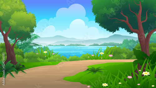 Dirt road beside river or sea with green grass, trees and mountain background under blue sky