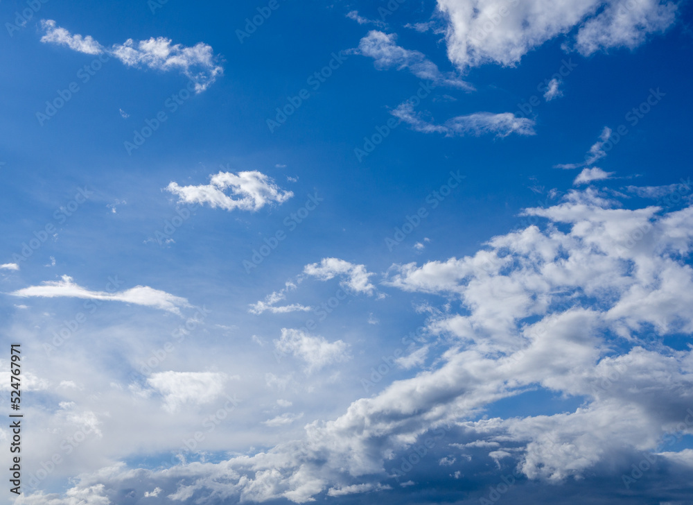 Obraz premium white fluffy clouds on blue sky in summer.
