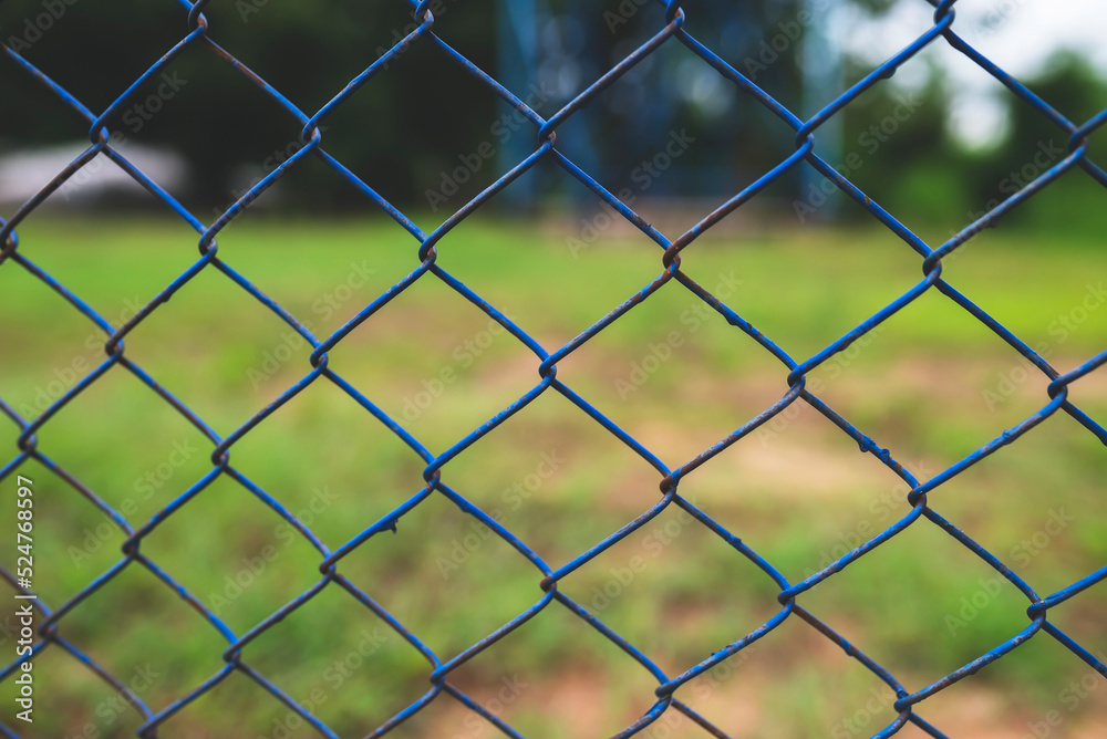 Chain link fence with blurred background : demarcation concept Chain link fence with blurred background : demarcation concept