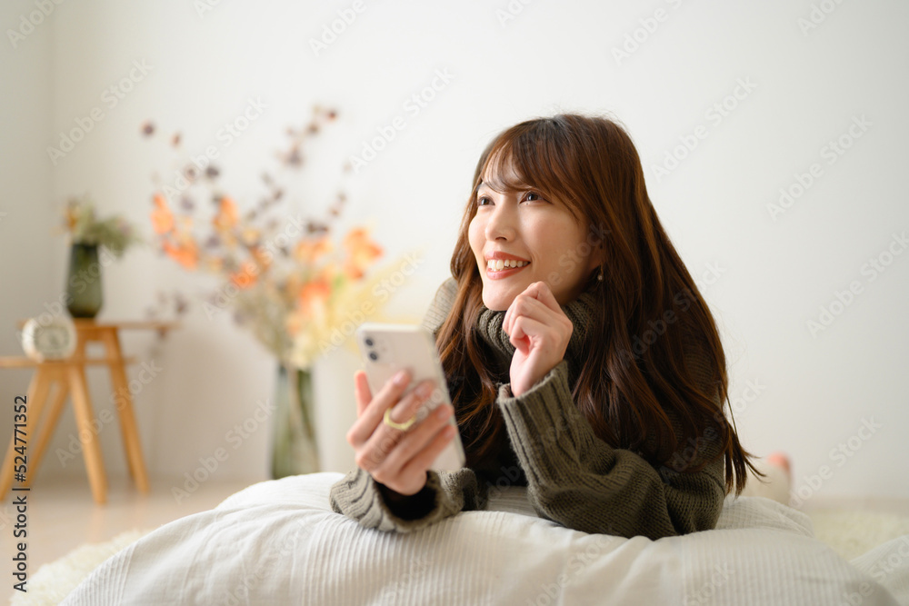 Woman tapping her phone Copy space available Autumn/Winter Knit Woman tapping her phone Copy space available Autumn/Winter Knit