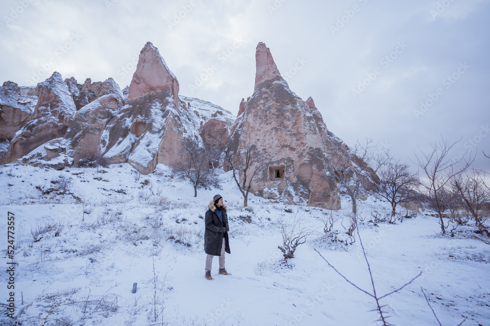portrait of asian man hiking on beautiful natural landscape in cappadocia turkey