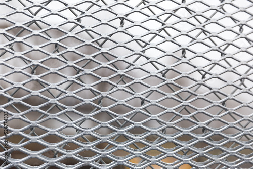 Diamond mesh on chain link fence