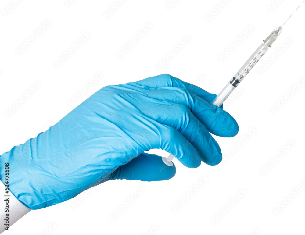 Hand wearing blue glove holding syringe. Hand wearing blue glove holding syringe.