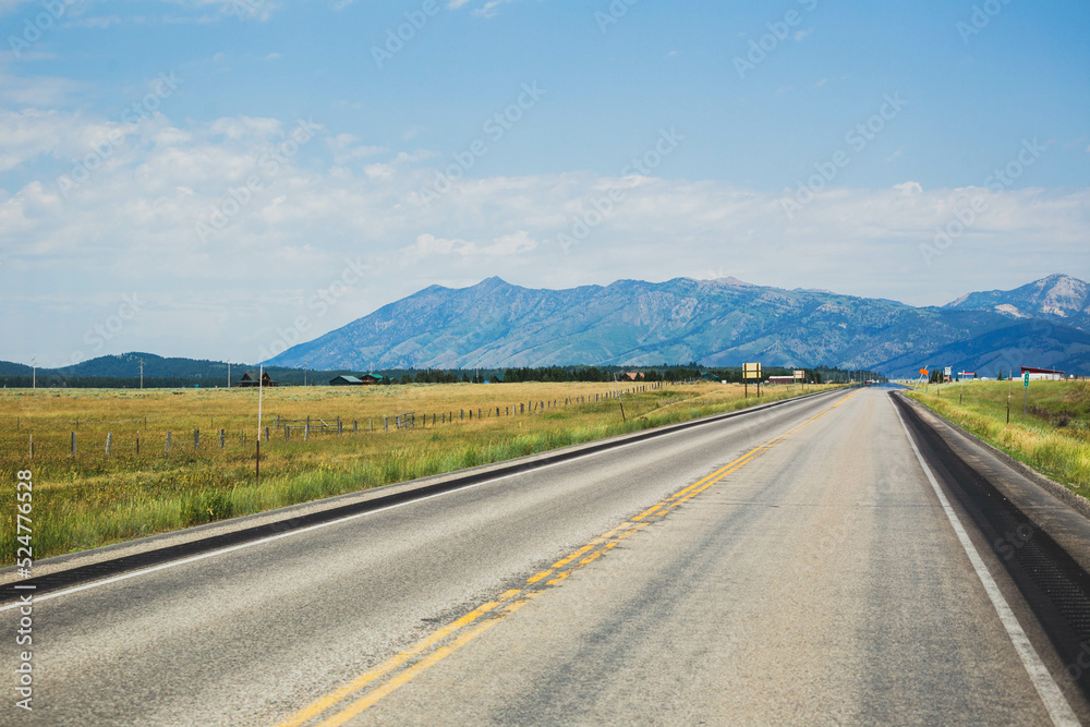 Road view of farmland and mountains