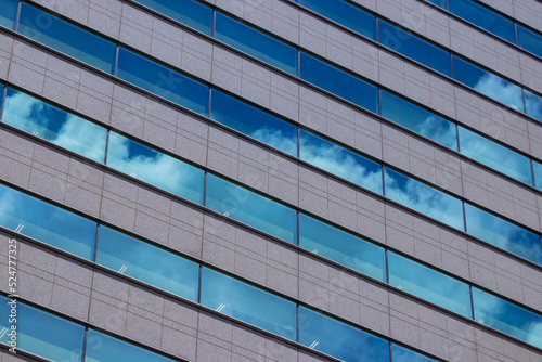 A cloud reflecting the building in the business town long shot