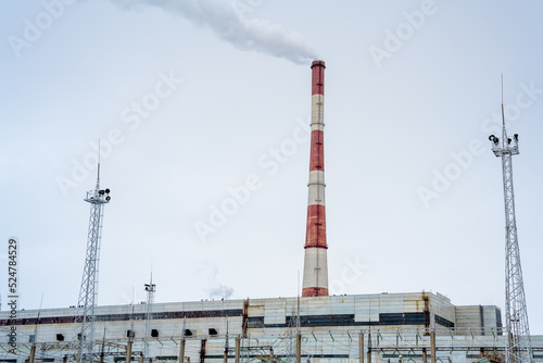 Gas combined heat and power plant with pipes, smoke, steam, power stations.