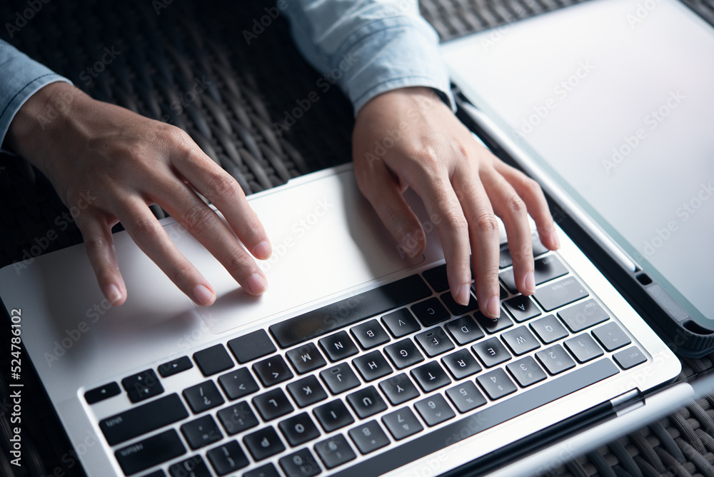 Woman hands typing on laptop computer on table at office. Female worker, freelancer online working from cafe, remotely work Woman hands typing on laptop computer on table at office. Female worker, freelancer online working from cafe, remotely work