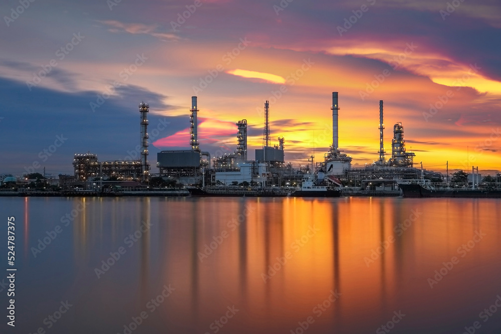 Oil refinery with sunrise background