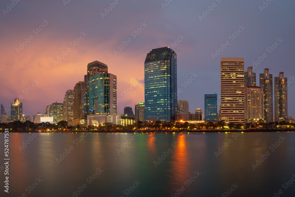 Bangkok Cityscape with building in an economic business district from Benjakitti park at dusk. (Thailand)