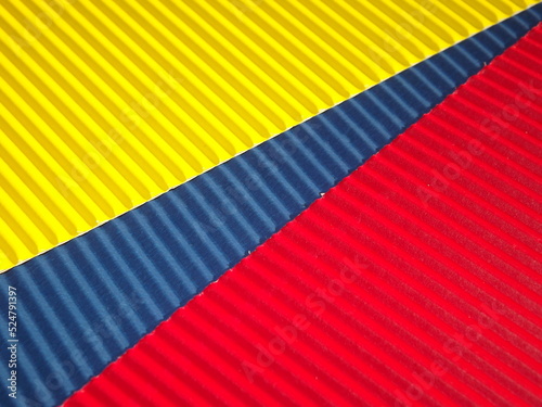 yellow blue RED ribbed corrugated background with diagonal STRIPE