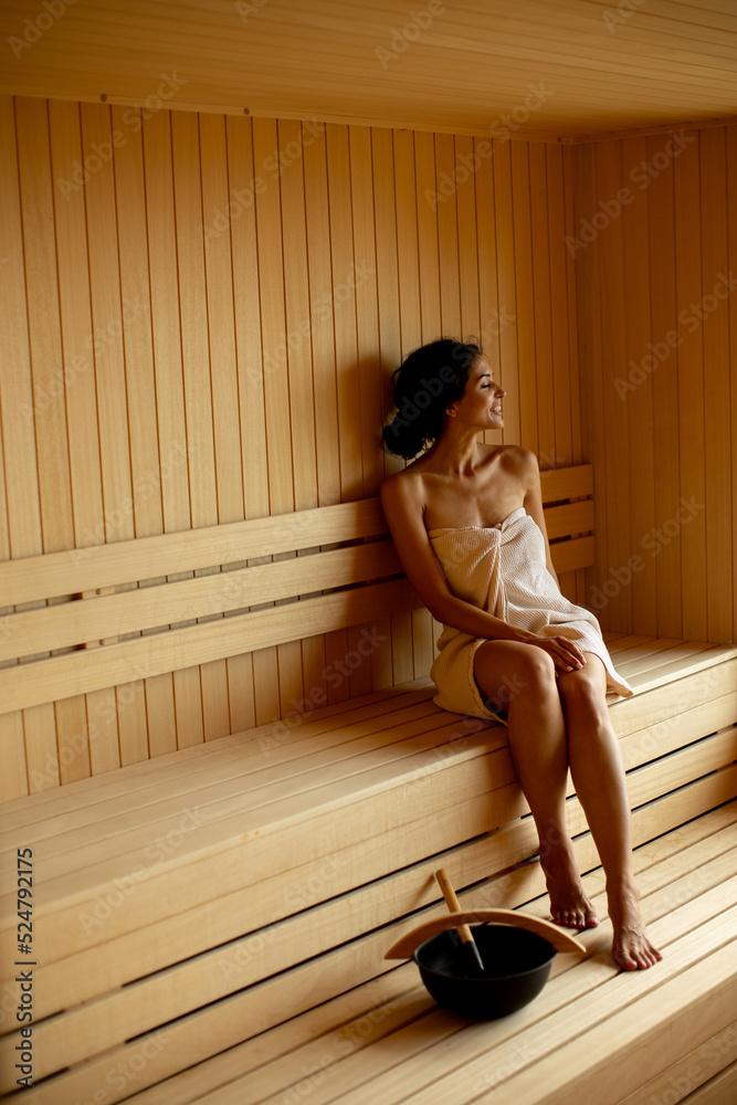 Young woman relaxing in the sauna Stock Photo | Adobe Stock