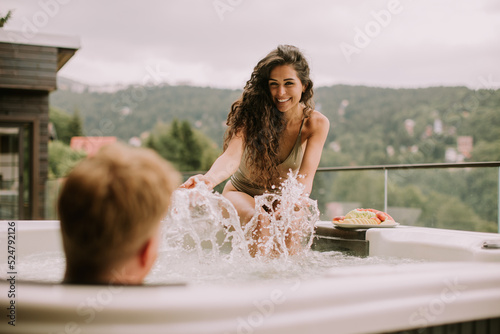 Young couple enjoying in ou...
